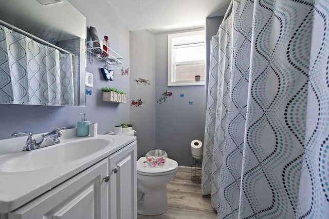 48 Rocliffe St, Fall River, MA 02723 - bathroom featuring toilet, vanity, wood finished floors, and curtained shower