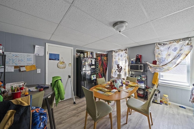 48 Rocliffe St, Fall River, MA 02723 - dining area with wood finished floors, a paneled ceiling, and a decorative wall