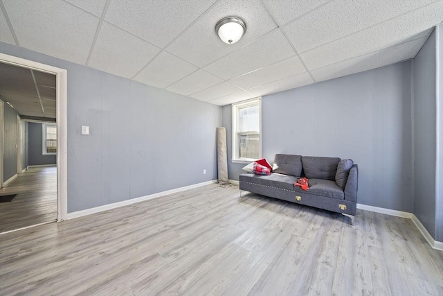 48 Rocliffe St, Fall River, MA 02723 - living area featuring a paneled ceiling, wood finished floors, and baseboards