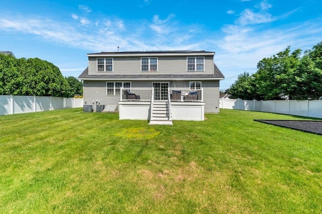 47 Fenwick Cir, Methuen, MA 01844 - rear view of house with a wooden deck and a fenced backyard