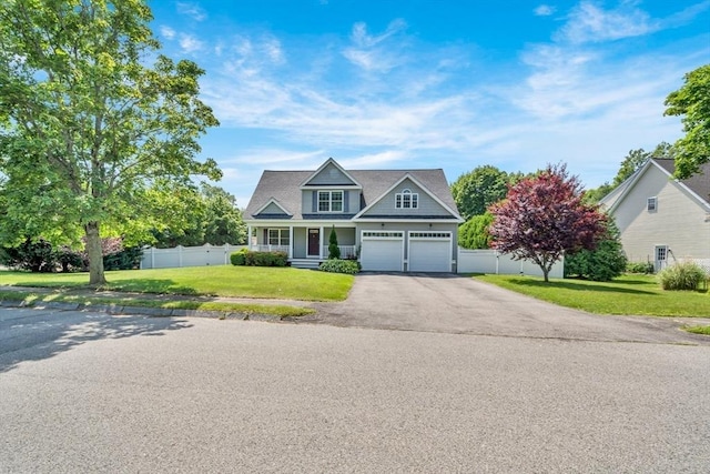 47 Fenwick Cir, Methuen, MA 01844 - view of front facade featuring driveway, a garage, and covered porch