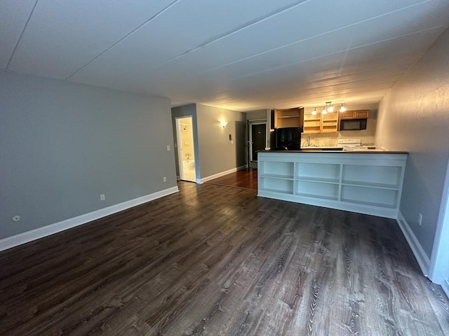 147 Turner Rd Unit 102, Holliston, MA 01746 - unfurnished living room with dark wood-style flooring and baseboards