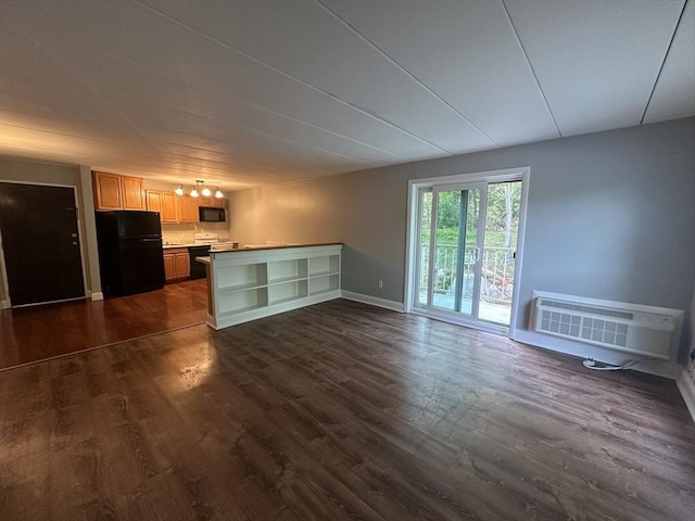 147 Turner Rd Unit 102, Holliston, MA 01746 - unfurnished living room with dark wood-style flooring and an AC wall unit