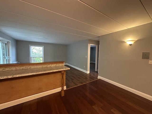 147 Turner Rd Unit 102, Holliston, MA 01746 - spare room with dark wood-style flooring and baseboards