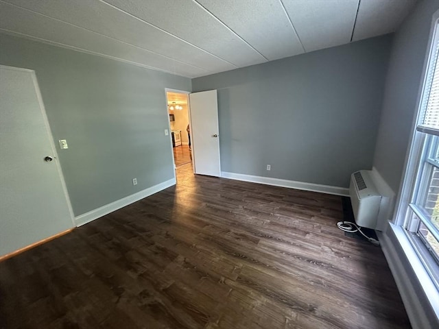 147 Turner Rd Unit 102, Holliston, MA 01746 - spare room with dark wood-style flooring and a wall unit AC