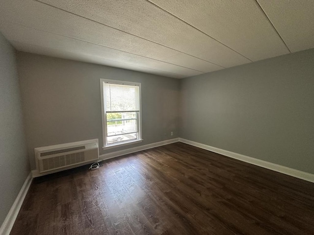 147 Turner Rd Unit 102, Holliston, MA 01746 - spare room featuring dark wood-style flooring and a wall mounted AC
