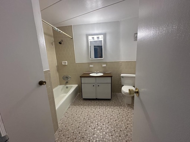 147 Turner Rd Unit 102, Holliston, MA 01746 - bathroom with tile walls, vanity, shower / bath combination, and wainscoting