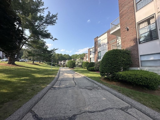 147 Turner Rd Unit 102, Holliston, MA 01746 - view of asphalt road featuring curbs