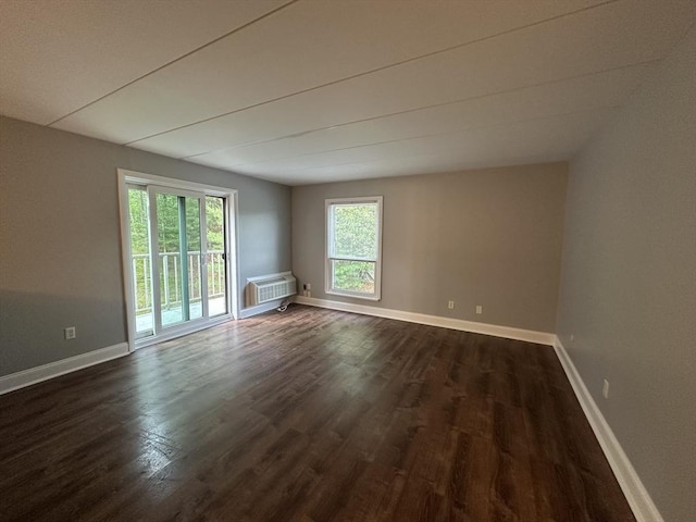147 Turner Rd Unit 102, Holliston, MA 01746 - spare room with dark wood finished floors and a wall mounted air conditioner