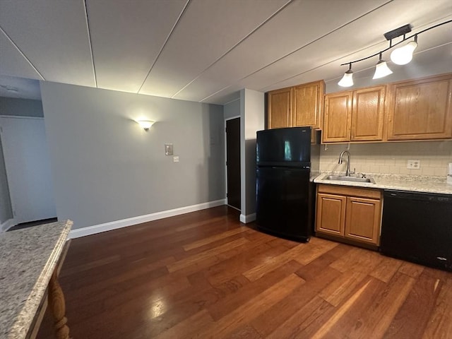 147 Turner Rd Unit 102, Holliston, MA 01746 - kitchen featuring black appliances, dark wood-style floors, tasteful backsplash, and light stone counters