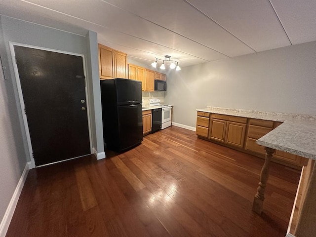 147 Turner Rd Unit 102, Holliston, MA 01746 - kitchen with black appliances, dark wood-type flooring, and light countertops
