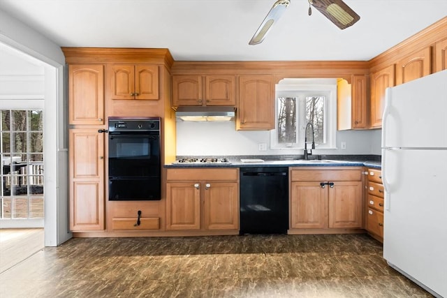 kitchen with a warming drawer, under cabinet range hood, a sink, plenty of natural light, and white appliances