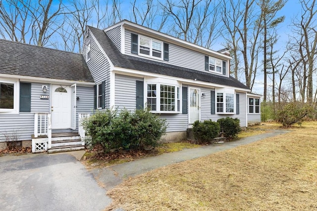 view of front of property with a shingled roof