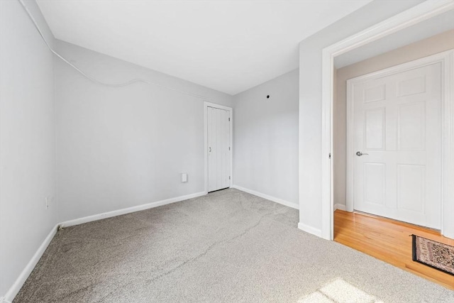 unfurnished bedroom with baseboards and carpet floors