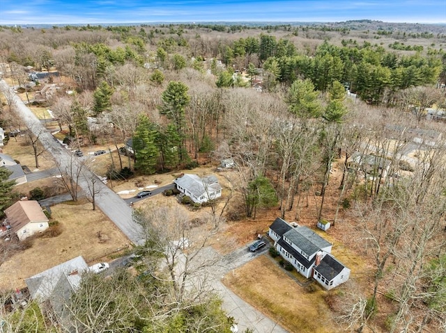 drone / aerial view featuring a forest view