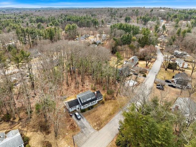 aerial view with a wooded view