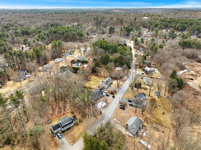 drone / aerial view featuring a forest view