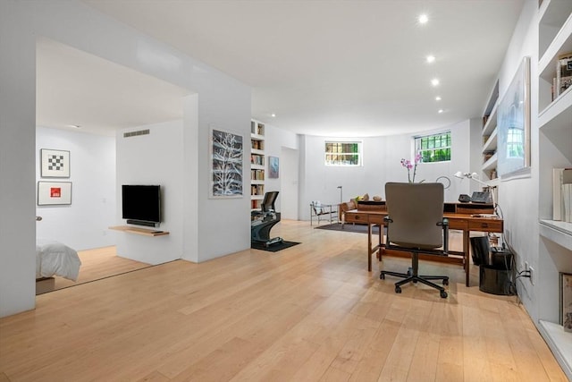 175 Commonwealth Ave Unit A, Boston, MA 02116 - office area featuring a wood stove, wood finished floors, recessed lighting, and built in features