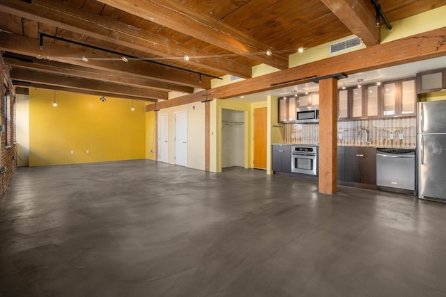 garage featuring stainless steel fridge, sink, and wooden ceiling