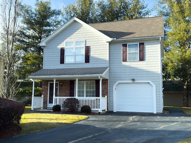 view of front of house with a porch and a garage