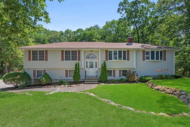 171 Taft Rd, Wilmington, MA 01887 - split foyer home with a chimney and a front lawn