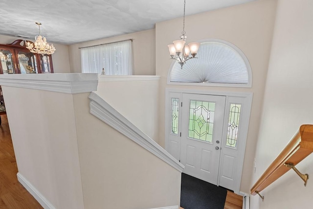 171 Taft Rd, Wilmington, MA 01887 - foyer featuring a chandelier and wood finished floors