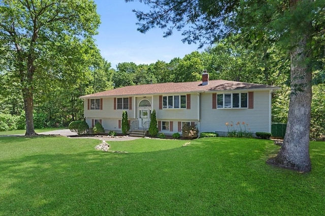 171 Taft Rd, Wilmington, MA 01887 - split foyer home with a chimney and a front yard