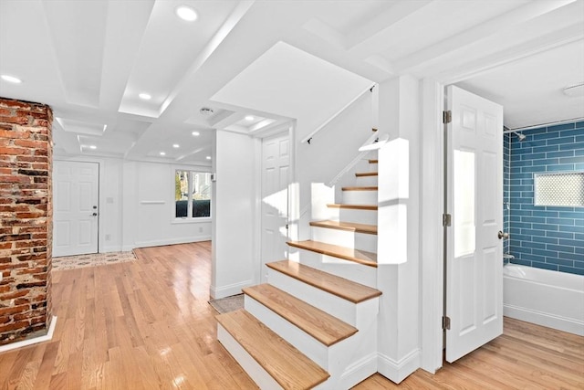 stairway with wood-type flooring