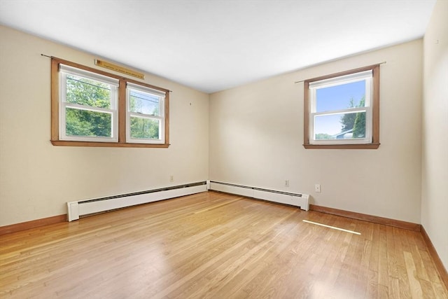101 Alpha St, Dartmouth, MA 02747 - unfurnished room with wood finished floors, a baseboard radiator, and baseboards