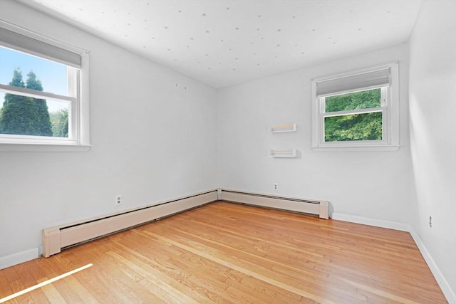 101 Alpha St, Dartmouth, MA 02747 - unfurnished room with healthy amount of natural light, wood finished floors, and baseboards