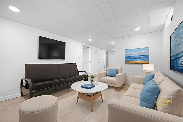 101 Alpha St, Dartmouth, MA 02747 - living area with light wood-style flooring, baseboards, recessed lighting, and a paneled ceiling