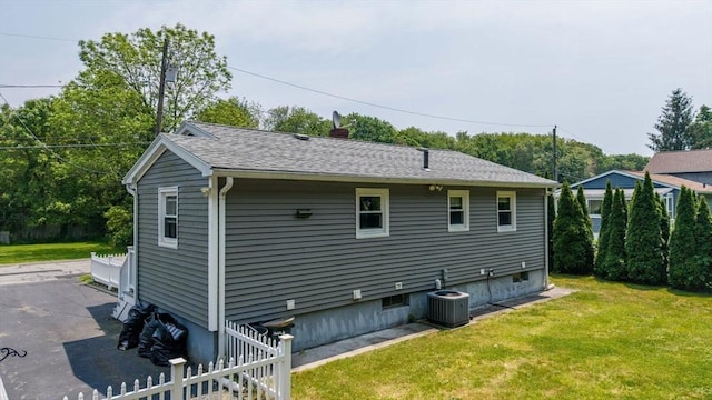 101 Alpha St, Dartmouth, MA 02747 - back of property featuring a lawn and central AC