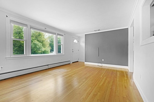 101 Alpha St, Dartmouth, MA 02747 - spare room featuring baseboard heating, light wood-style floors, baseboards, and crown molding