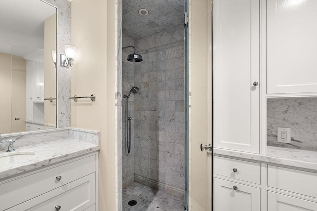 bathroom with vanity and a shower stall