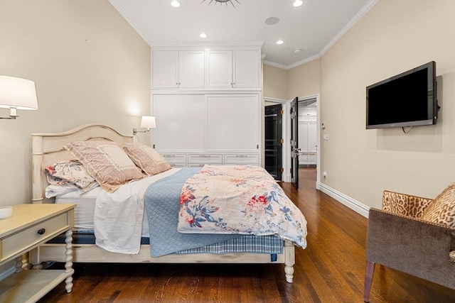 bedroom with dark wood finished floors, recessed lighting, crown molding, and baseboards