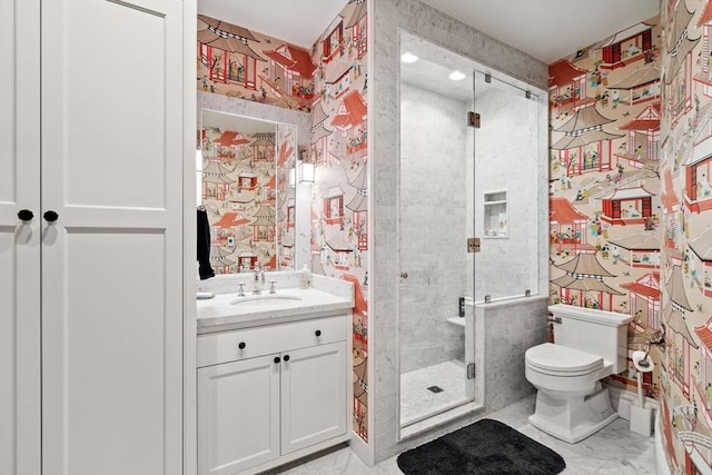 bathroom featuring wallpapered walls, a shower stall, toilet, and vanity