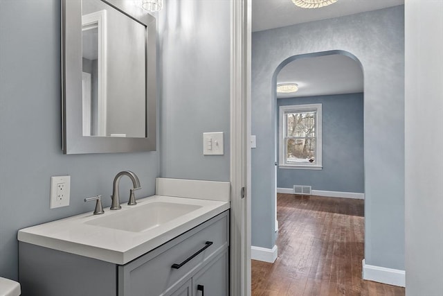 bathroom with vanity and hardwood / wood-style flooring