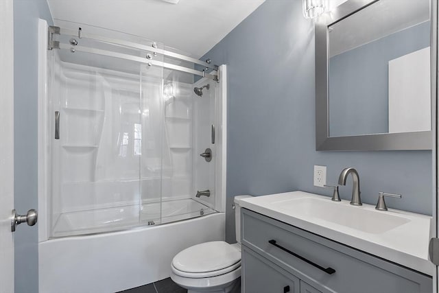 full bathroom with enclosed tub / shower combo, tile patterned flooring, vanity, and toilet