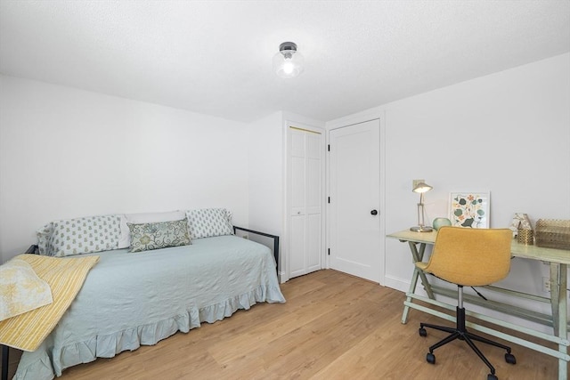 bedroom featuring light wood-type flooring