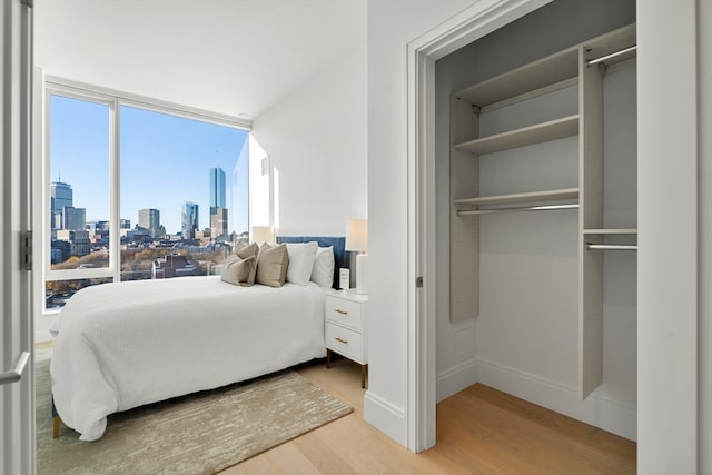 bedroom with wood-type flooring