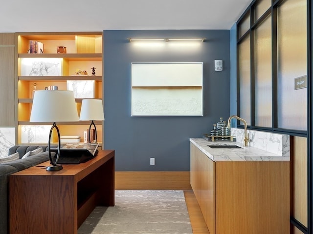 interior space featuring light hardwood / wood-style floors and sink