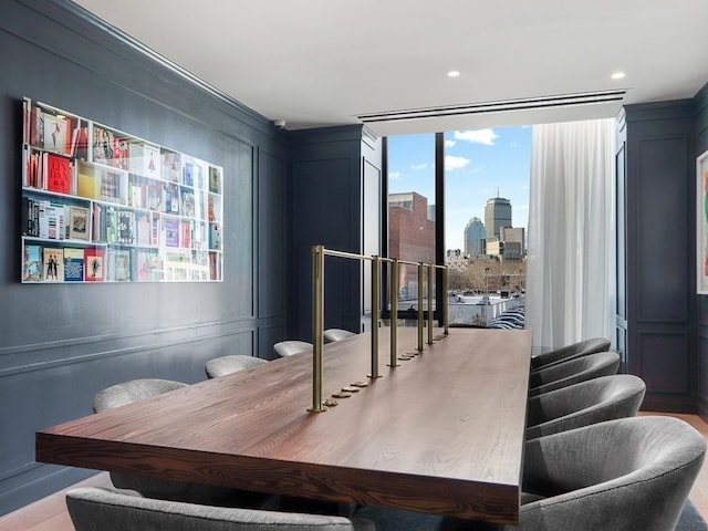 dining space with hardwood / wood-style flooring