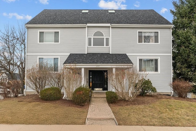 view of front of property with a front lawn