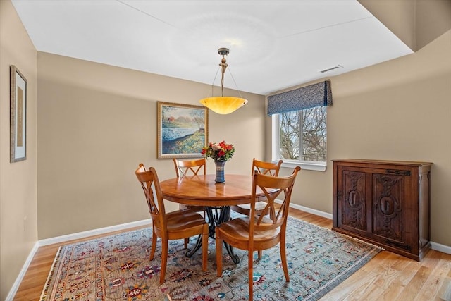 dining space featuring light hardwood / wood-style floors