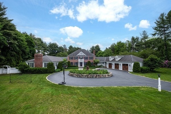 view of front of house with a front yard and a garage