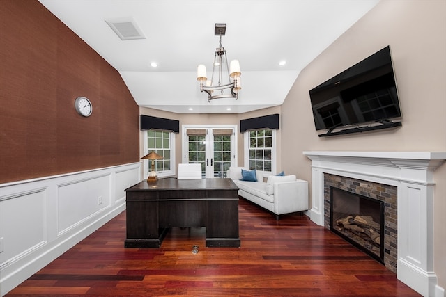 unfurnished office with lofted ceiling, french doors, a notable chandelier, and dark wood-type flooring