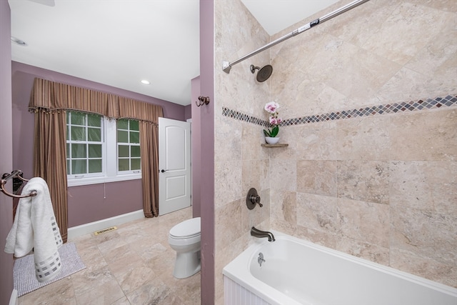 bathroom featuring toilet and shower / bath combo with shower curtain