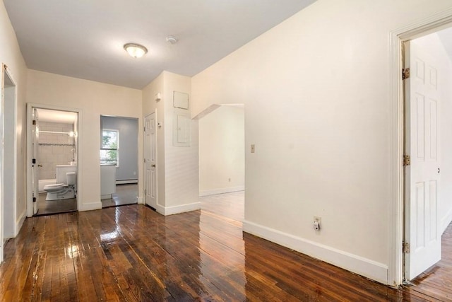 25-29 Astoria St, Boston, MA 02126 - unfurnished bedroom with baseboard heating, ensuite bathroom, wood-type flooring, and baseboards