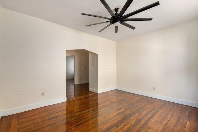 25-29 Astoria St, Boston, MA 02126 - empty room featuring arched walkways, baseboards, a ceiling fan, and dark wood finished floors