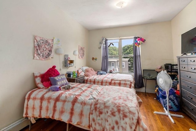 25-29 Astoria St, Boston, MA 02126 - bedroom featuring baseboard heating and wood finished floors